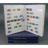 An album of mint GB stamps together with an album of used world stamps and a stock book of used GB