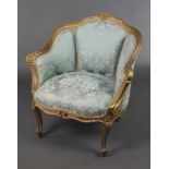 A 19th Century French gilt painted show frame salon armchair upholstered in blue material raised