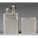 An engine turned silver cased cigarette lighter, Sheffield 1947 2 1/4"