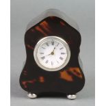 An Edwardian tortoiseshell and silver mounted bedroom timepiece on ball feet, London 1911, 4"