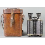 Ross of London, a pair of prism binoculars marked X12 no.13874 contained in a leather carrying case