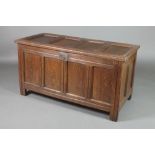 An 18th Century oak coffer of panelled construction with hinged lid, 25 1/2"h x 48"w x 22"d