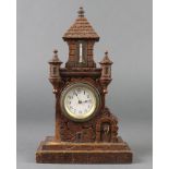 A 19th Century Continental timepiece with paper dial and Arabic numerals, contained in a carved