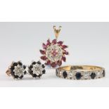 A 9ct yellow gold sapphire and diamond ring, size N 1/2, a pair of diamond and gem set ear studs and