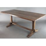 An oak refectory dining table with triple plank top, raised on square supports with H framed