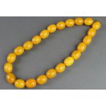 A yellow amberoid bead necklace 18"