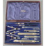 A 13 piece geometry set contained in a red leather case