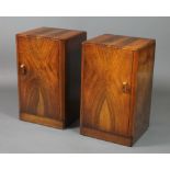 A pair of Art Deco walnut bedside cabinets enclosed by panelled doors 24 1/2"h x 15"w x 13 1/2"d