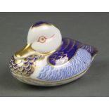 A Royal Crown Derby paperweight in the form of a seated duck 4 1/2", boxed