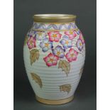 A Charlotte Rhead polychrome baluster ribbed vase decorated with flowers and Autumn leaves, 672, 8"h