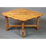 An oak Arts & Crafts diamond shaped occasional table with planked and studded top, raised on 4