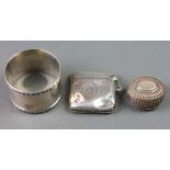 A silver vesta, a ditto napkin ring and a Continental repousse silver box