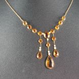 An Edwardian 15ct gold topaz and seed pearl drop pendant