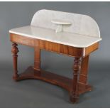 A Victorian mahogany Duchess washstand with raised marble back, raised on turned and fluted