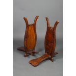 A pair of mahogany boot jacks