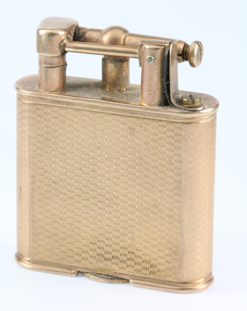 A Dunhill 9ct gold petrol cigarette lighter with engine turned decoration 2" There are some dents to