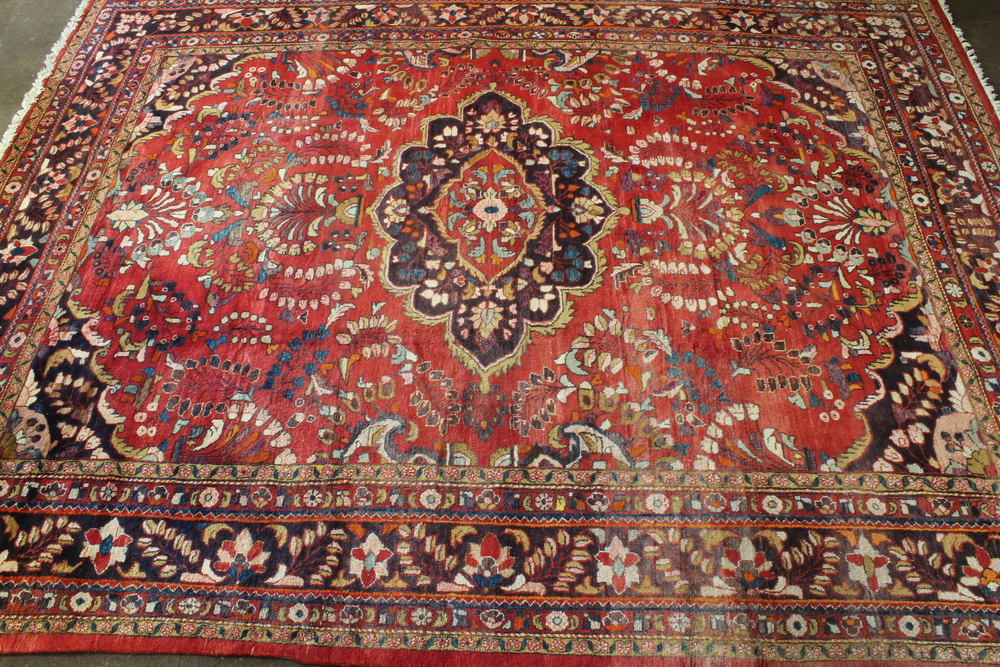 A Persian Lilian carpet 169" x 130"