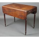 A 19th Century mahogany Pembroke table fitted a frieze drawer and raised on turned supports 28"h x