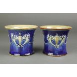 A pair of Royal Doulton waisted vases, the blue ground with cornucopia and swags 4" There is a minor