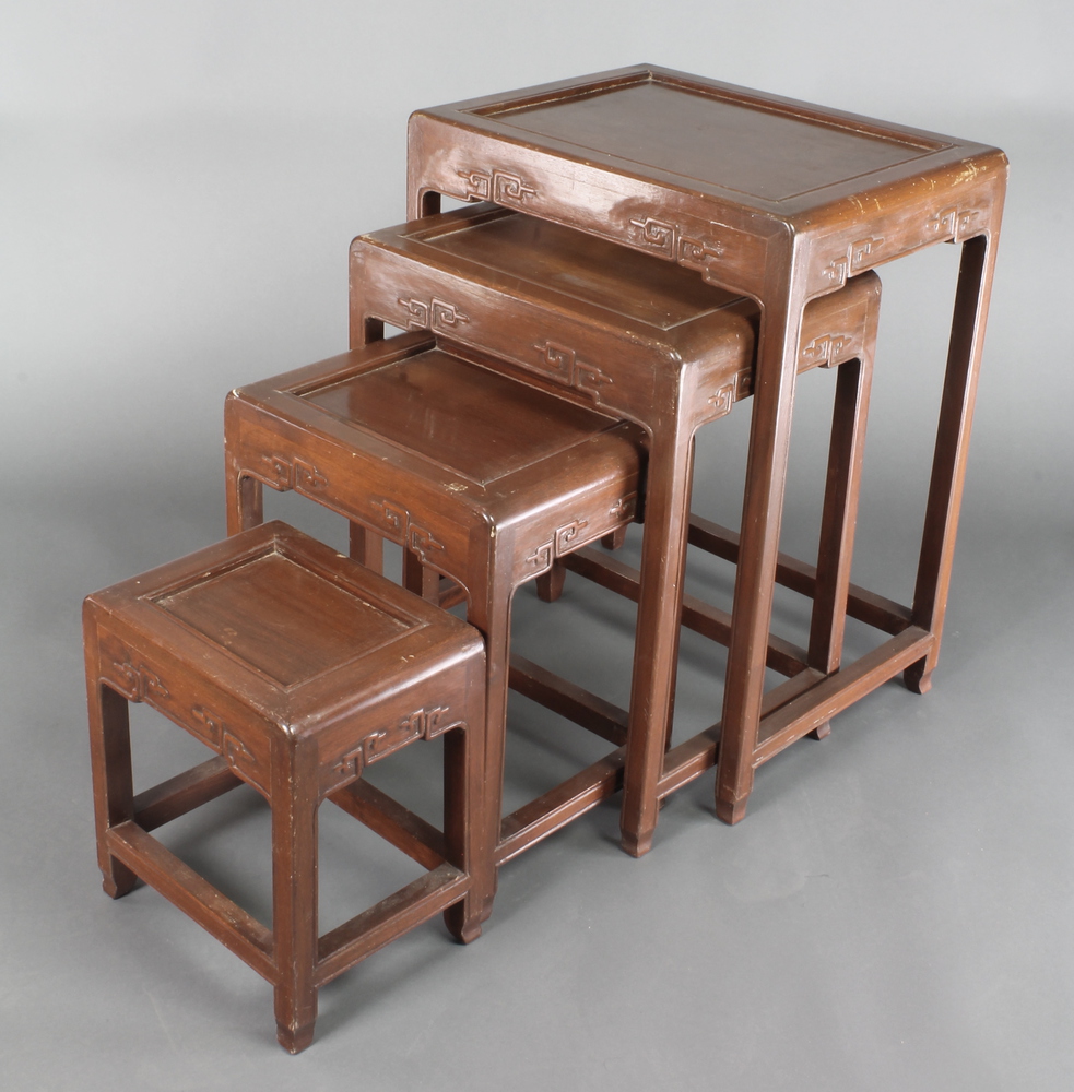 A nest of 4 Chinese Padouk wood interfitting coffee tables, largest - 26" x 19" x 15"d, smallest
