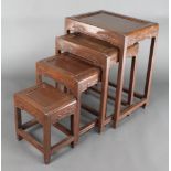 A nest of 4 Chinese Padouk wood interfitting coffee tables, largest - 26" x 19" x 15"d, smallest