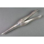 A pair of silver glove stretchers in the form of a ducks head, 7"