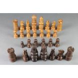 A St George's style pattern turned hardwood chess set The white castle is missing some castellation,