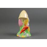 A Royal Winton Art Deco sugar shaker in the form of an elf beneath a toadstool 5 1/2"