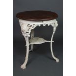 A circular cast iron pub table with decoration in the form of noblemen, having a mahogany top,