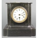 A Victorian French 8 day timepiece with enamelled dial and Arabic numerals contained in a black