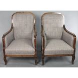 A pair of Biedermeier style show frame armchairs upholstered in cream material There is some light