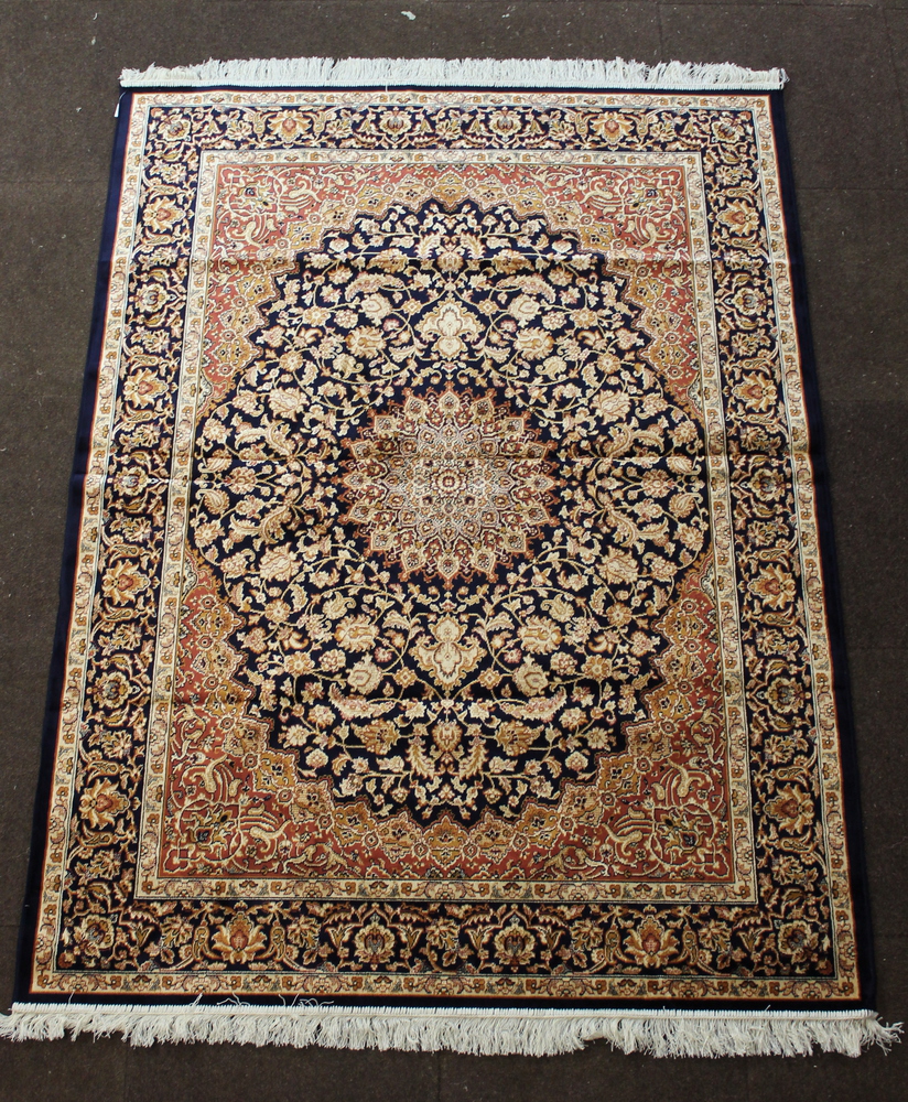 A blue and white ground Belgian cotton Persian style rug with central medallion 75" x 56"