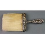 An Edwardian repousse silver brush, import marks, Chester 1902