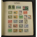 An album of stamps including St Helena, St Kitts Nevis, St Lucia, St Vincent