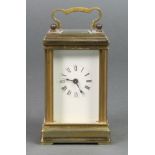 A miniature French carriage timepiece with enamelled dial and Roman numerals, the back plate