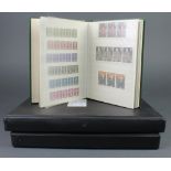 A stock book of various mint GB stamps, an album of GB first day covers and an album of various