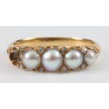 An 18ct yellow gold 4 ex 5 pearl and diamond ring, size M