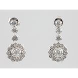 A pair of 18ct white gold diamond cluster earrings, suspended by 3 brilliants 1.5ct