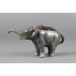 An Edwardian antimony pin cushion in the form of a walking elephant 6"