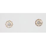 A pair of white gold single stone diamond ear studs, each approx. 0.4ct