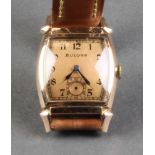 A gentleman's 1930's Bulova 14k gold plated cased tonneau wristwatch with seconds at 6 oclock on a