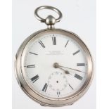 A silver key wind pocket watch with seconds at 6 o'clock