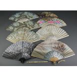 An early 20th Century Japanese fan painted floral decoration 9", 7 other fans and a fan handle