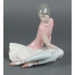 A Lladro figure of a seated ballerina 1357 7"