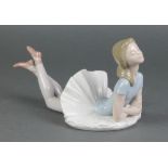 A Lladro figure of a reclining ballerina 10"