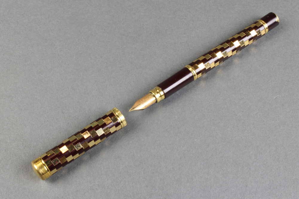 A lady's 1970's Waterman fountain pen with chequer decorated barrel and 18ct nib