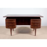 A DANISH ROSEWOOD DESK, 1960s, the plain