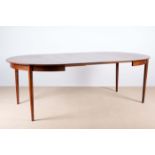 A DANISH ROSEWOOD EXTENDING DINING TABLE