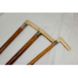 3 Ivory and silver handled walking sticks