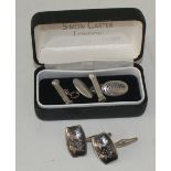 Pair of silver cufflinks and a pair of pewter cased cufflinks